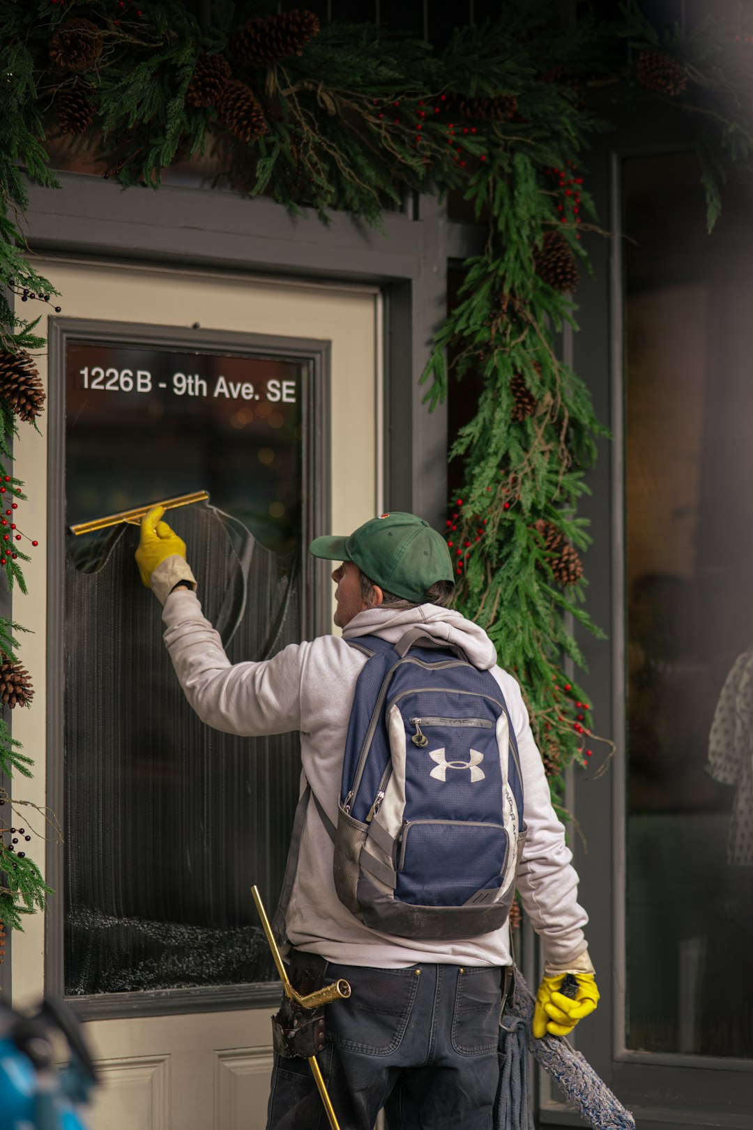 heros-img man-cleaning-a-storefront-window-with-a-squeegee-mg29fmiyng0